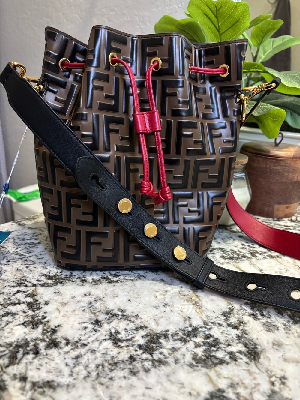 Fendi Brown Embossed FF Bucket Bag with Red Drawstring and Black Strap